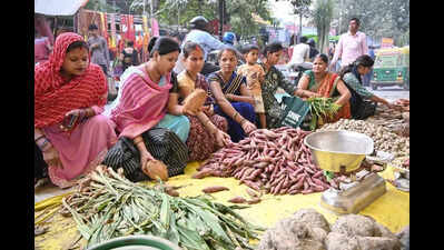 Women buy Chhath items Thousands of migrants return to Bihar for Chhath and upcoming elections