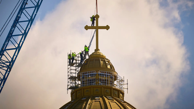 The final stages of installation for the main cross of the National Cathedral (Image credits: AP) Romania opens world's biggest Orthodox church