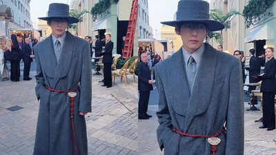 Hollywood with a look blending Korean heritage and high fashion. His ensemble, featuring a grey overcoat with a red jade belt, paid homage to Joseon-era royalty. V's appearance showcased organic cultural expression, proving his status as a global style icon. BTS' V channels modern Korean royalty in Hollywood
