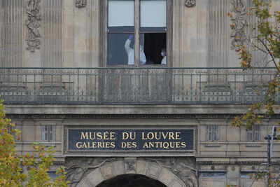 Police officers work inside the Louvre museum, Sunday, Oct. 19, 2025 in Paris. (AP Photo/Thibault Camus) A German lift, Napolean's lost bling, and the fake 'detective': How Louvre heist became a quintessential French affair