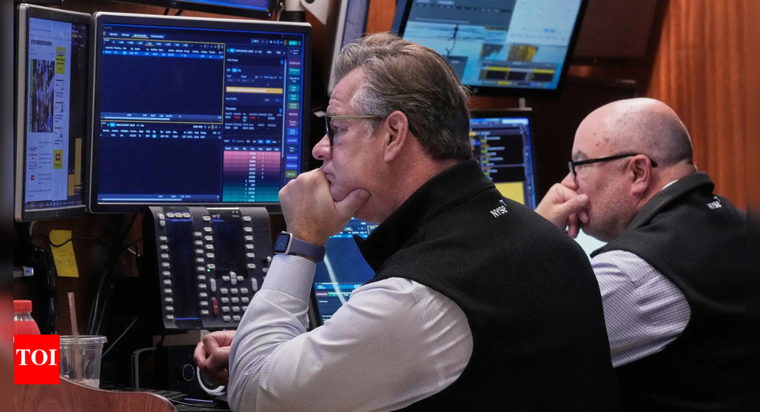 US markets today: Stocks hover near record highs as investors await Fed decision; Nvidia, Caterpillar and Teradyne lead gains