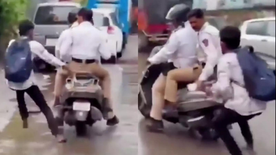 Biker gets Thane traffic cop fined for violations  Biker gets Thane traffic cop fined for multiple violations after viral video exposes helmetless ride, missing number plate