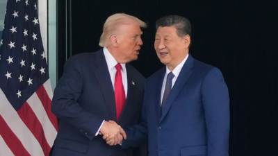 President Donald Trump, left, and Chinese President Xi Jinping, shake hands after their meeting at Gimhae International Airport in Busan, South Korea, Thursday, October 30, 2025. (AP)  Trump rates high-stakes US-China talk; calls him 'tremendous leader'