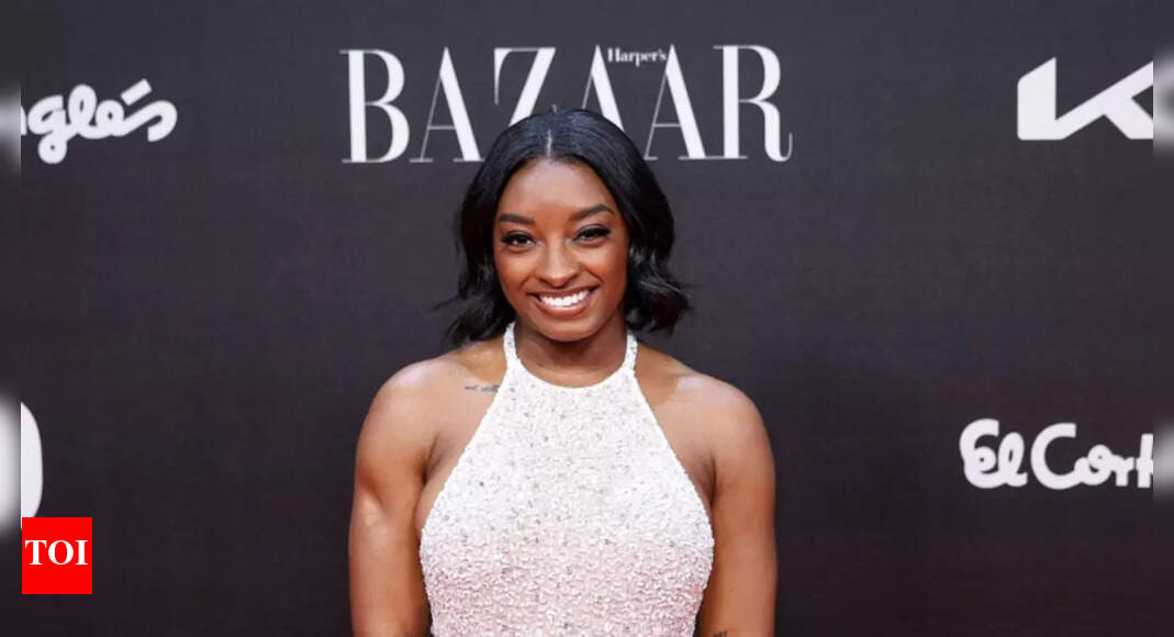 Jonathan Owens’ wife Simone Biles wows in shimmering silver look at Harper’s Bazaar Women of the Year Awards 2025