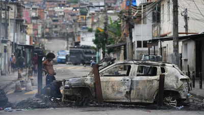 Brazilian police accused of hanging teen gangster’s head ‘like a trophy’ in anti-drug raid that killed over 120