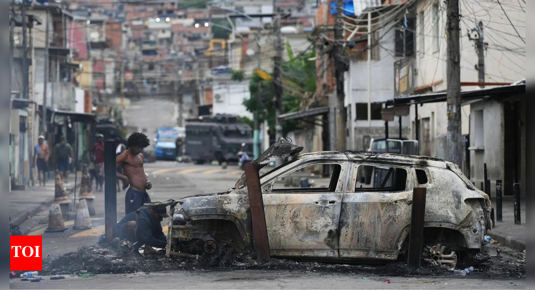 Brazilian police accused of hanging teen gangster’s head ‘like a trophy’ in anti-drug raid that killed over 120
