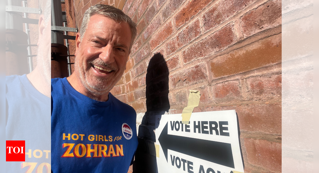 Former NYC mayor Bill de Blasio votes for Mamdani wearing viral ‘Hot Girls for Zohran’ T-shirt — see photo