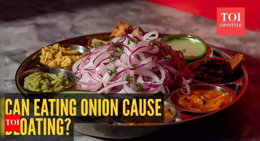 Can eating raw onion cause bloating and discomfort?