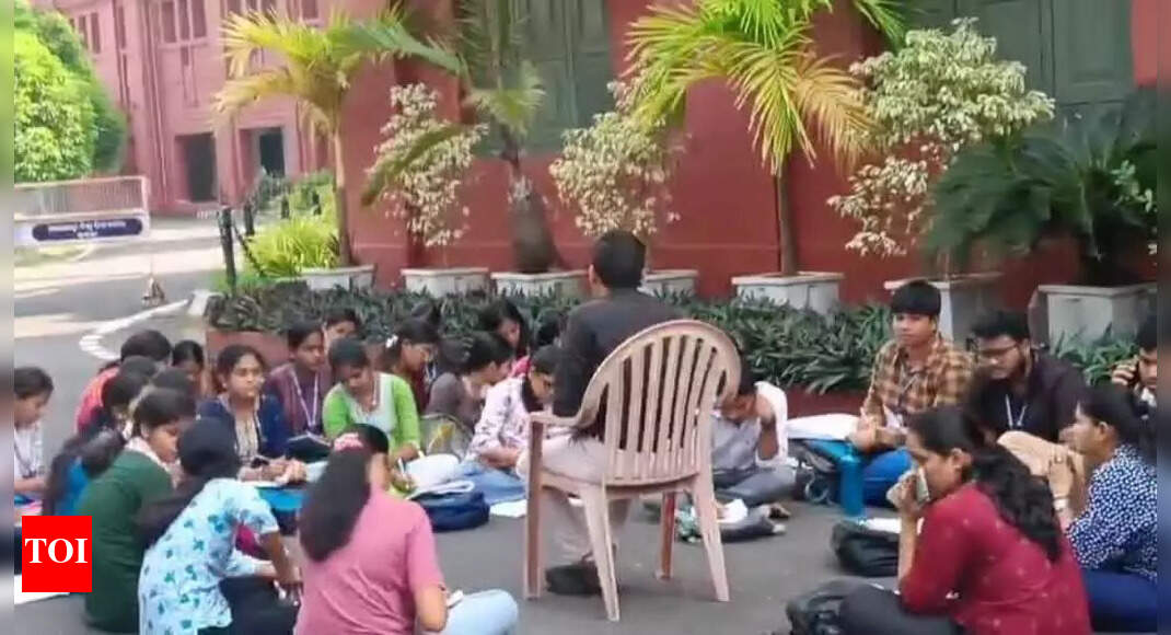 Students study in the open to protest poor condition of classroom at Ravenshaw