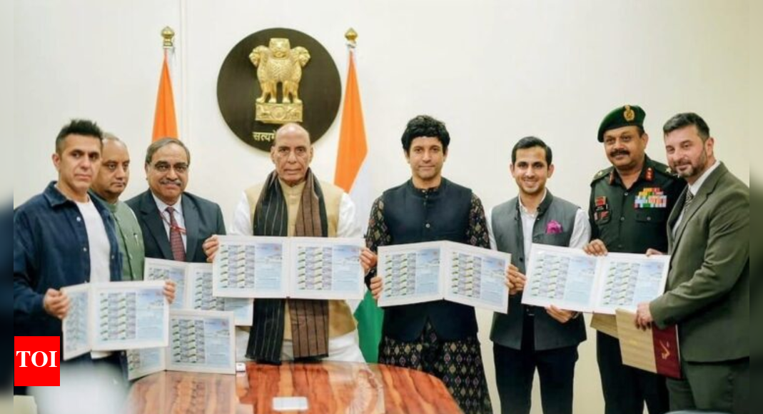 Defence Minister Rajnath Singh unveils Rezang La memorial stamp along with Farhan Akhtar and the team of '120 Bahadur'