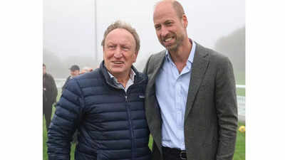 ‘Fan’ Prince William poses with football legend Neil Warnock after helping a local club secure a new road