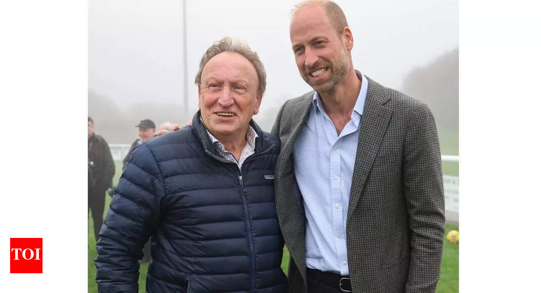 ‘Fan’ Prince William poses with football legend Neil Warnock after helping a local club secure a new road