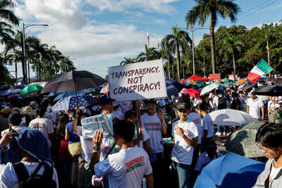 Tens of thousands rally in Manila over corruption scandal that implicates top Philippine officials