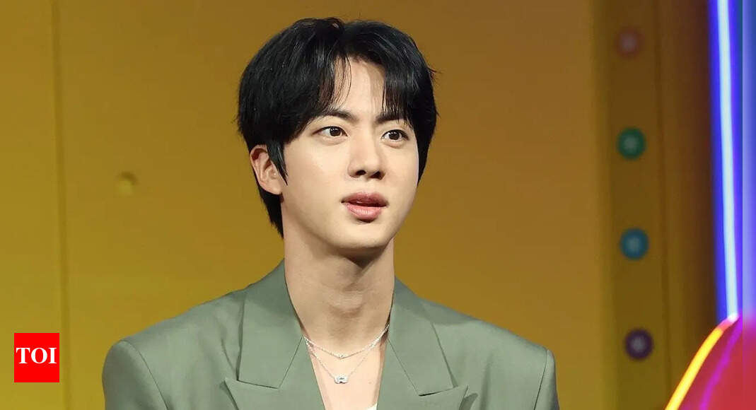 Woman prosecuted for kissing BTS star Jin