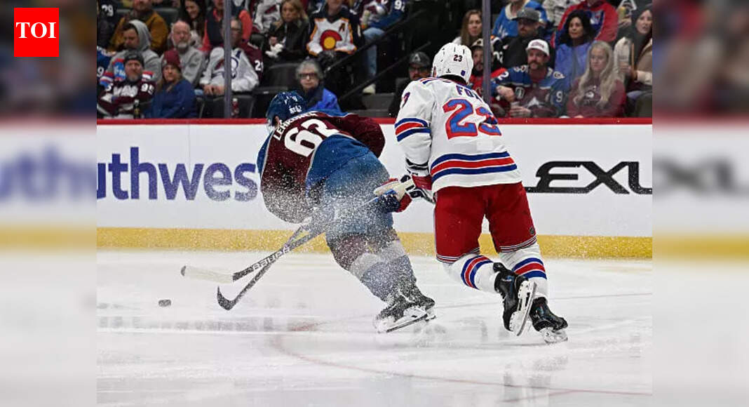 Front-row fan shocks Artturi Lehkonen and Adam Fox during Colorado Avalanche at Rangers game