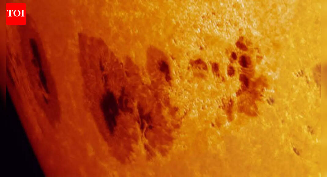 Why did a minor sunspot erupt while a huge one rotated toward Earth’s side