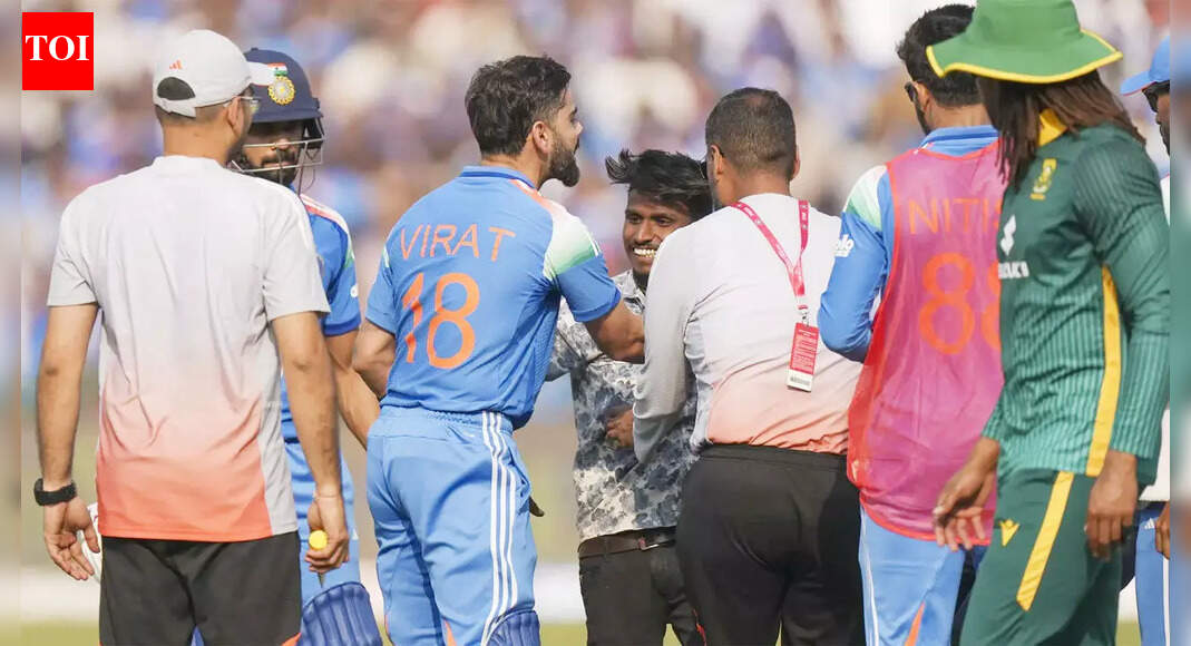 Fan sprints toward Virat Kohli, security drags him away - WATCH