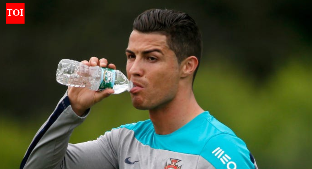 Why does Cristiano Ronaldo spit water out instead of drinking it in the middle of a match?
