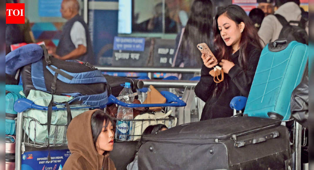 Get set, no-go: You can check in any time, but you can't leave!; cancellations leave flyers stranded at Delhi airport