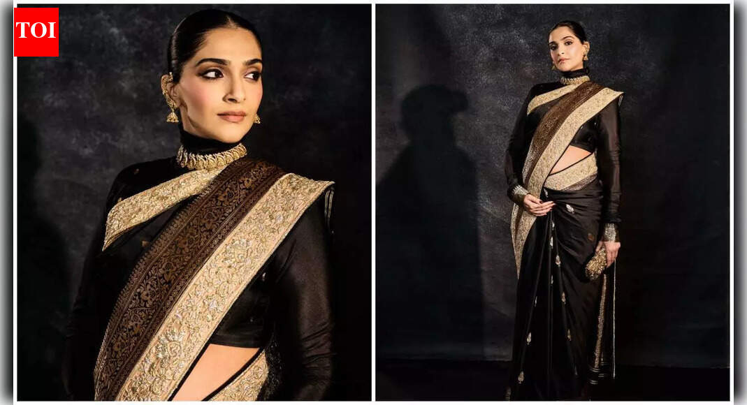 Sonam showcases her baby bump in a black Banarasi saree