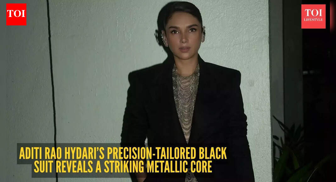 Aditi Rao Hydari reinvents power dressing in a sleek black suit framed by traditional metallic architecture