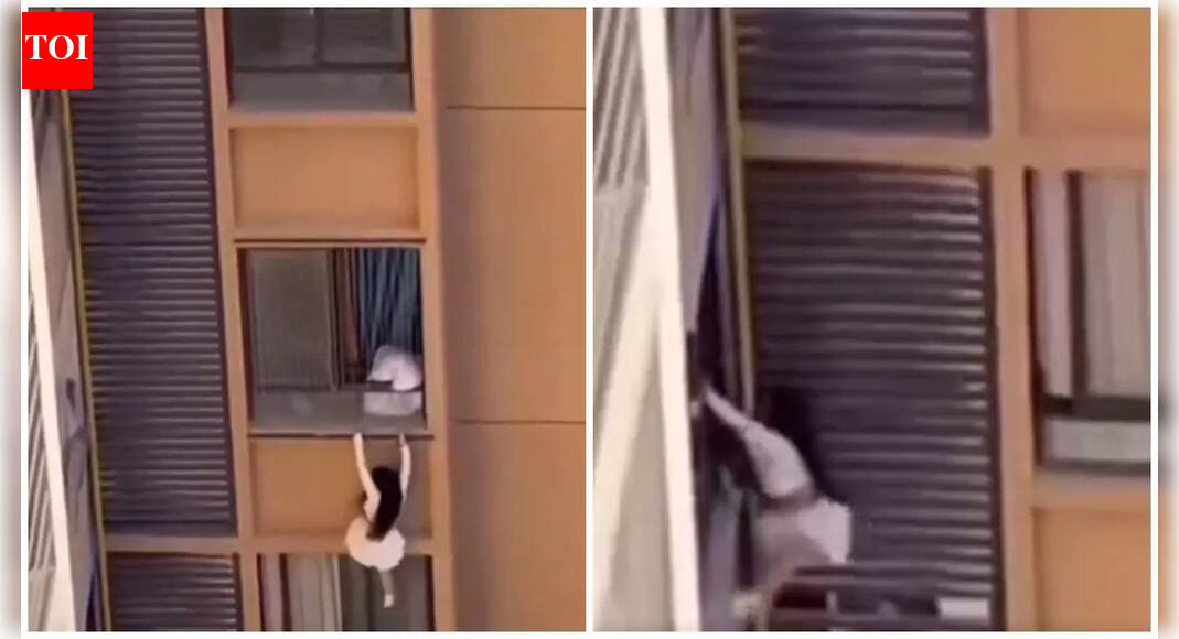 'Falling' for him: Mistress dangles from 10th-floor balcony in China after lover’s wife returns home — Watch