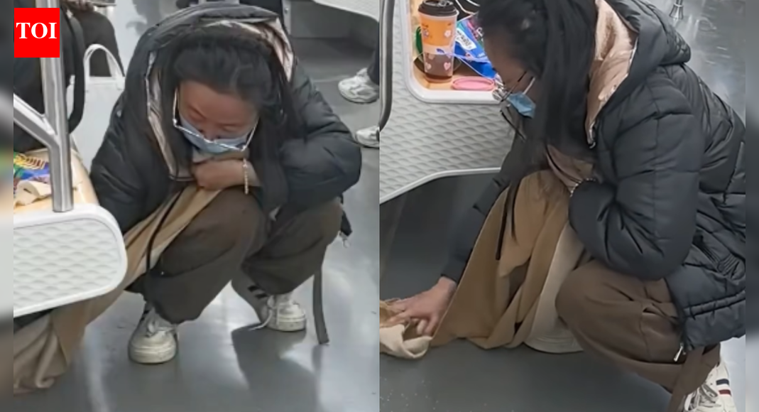 Chinese woman uses her scarf to clean up spilled bubble tea in metro — watch