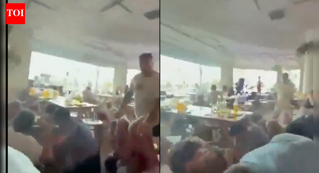 Bondi beach mass shooting: Video captures people fleeing to nearby café for cover - watch