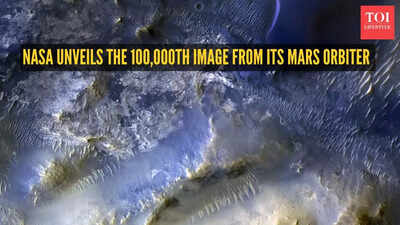 A blue sea of shifting dunes: NASA unveils the 100,000th image from its Mars orbiter
