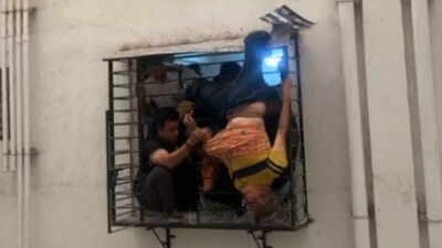 Christmas Day miracle in Surat: Man slips from 10th floor, gets stuck on 8th floor window grill; heart-stopping visuals emerge