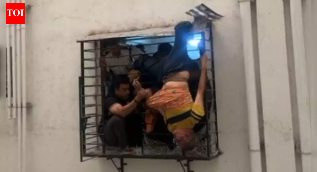Christmas Day miracle in Surat: Man slips from 10th floor, gets stuck on 8th floor window grill; heart-stopping visuals emerge