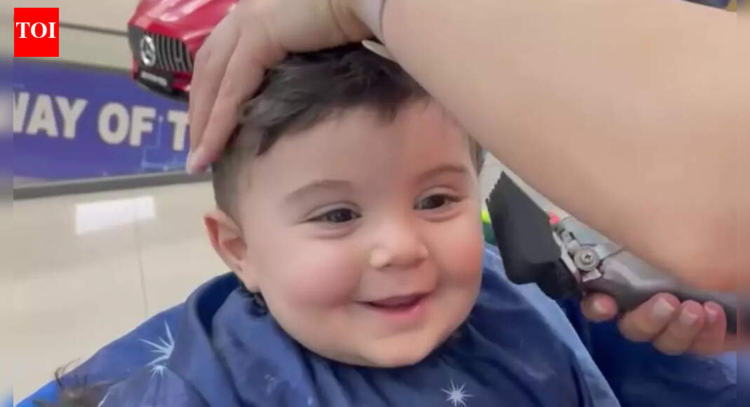 Toddler getting a haircut with a constant smile is going to melt your heart; watch video