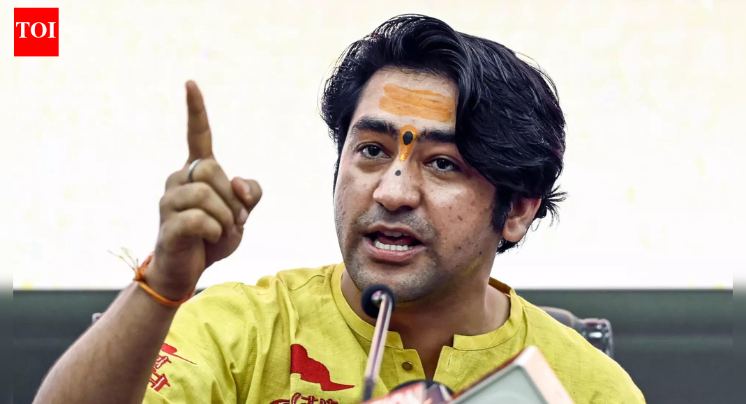 ‘Wastage of public money’: Congress targets video of Bageshwar Dham head on govt plane, cop touching feet; BJP hits back