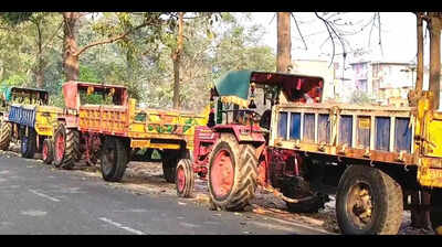 Minister catches 3 tractors illegally carrying sand