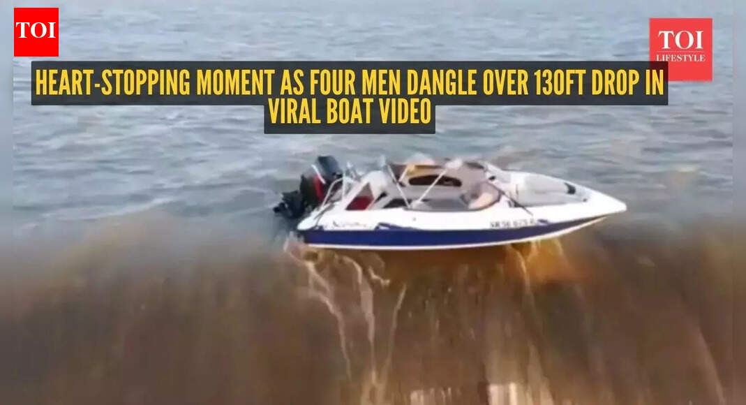 Heart-stopping moment as four men dangle over 130ft drop in viral boat video