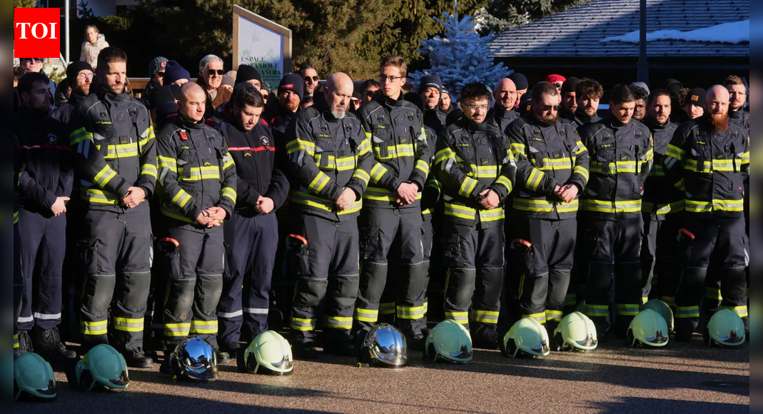 Hundreds march in silence to honor victims of Swiss bar fire that left 40 dead