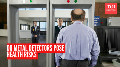Are there any health risks of walking through metal detectors?
