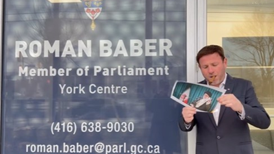 Canada MP joins viral Iran protest trend, lights cigar with burning portrait of Khamenei in front of office