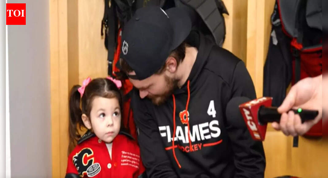 Johnny Gaudreau’s daughter Noa steals a cute moment with Rasmus Andersson at Calgary Flames media availability
