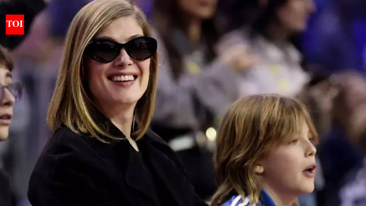 Hollywood star Rosamund Pike makes rare NBA courtside appearance with son Atom in London