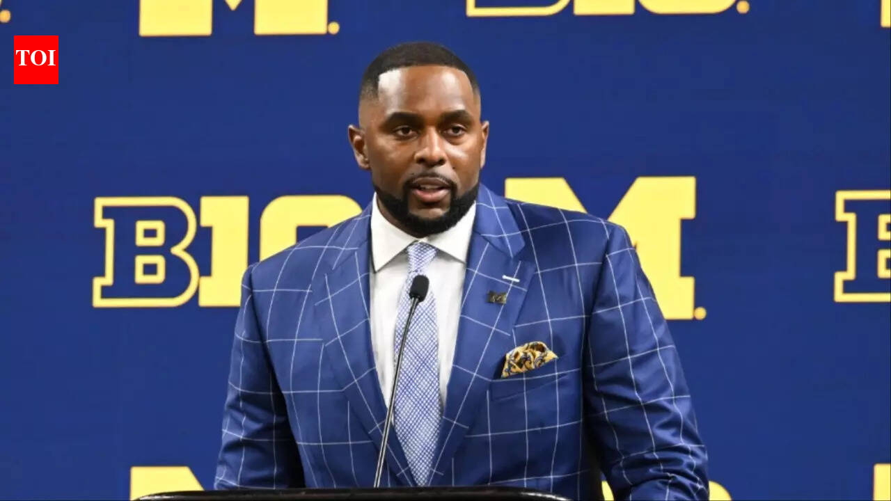 Sherrone Moore seen smiling with his wife as he appears in court for first time since his arrest