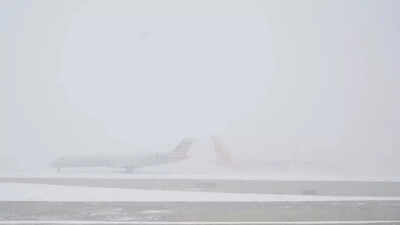 Winter storm grounds US air travel: Over 10,000 flights cancelled on Sunday as snow batters major hubs
