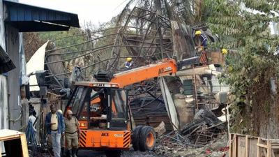 Fire toll now 25; skeletons, wreckage stall investigation