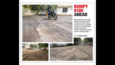 In Noida’s Film City, road left cratered by rain still waiting for repairs