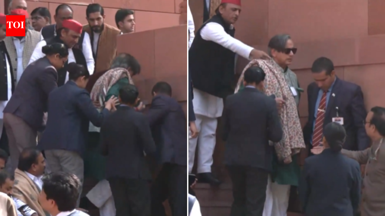 Shashi Tharoor trips and falls at Parliament stairs; Akhilesh Yadav helps - video