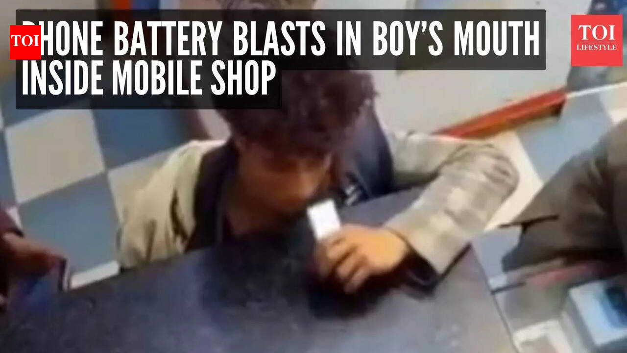 Terrifying moment caught on camera: Phone battery blasts in boyâs mouth inside mobile shop - The Times of India