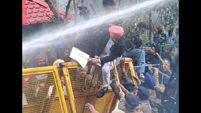 UT cops open water cannons on AAP stir against Bajwa’s remark
