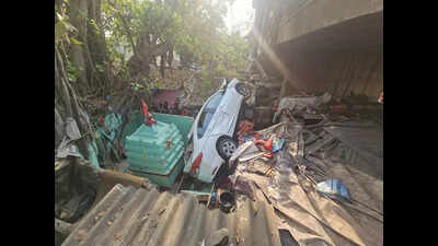 Car fleeing murder scene plunges 20ft from overbridge