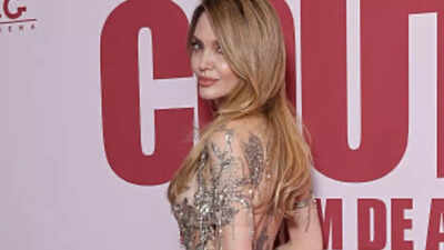 Angelina Jolie stuns in sheer dress at 'Couture' Paris premiere - WATCH