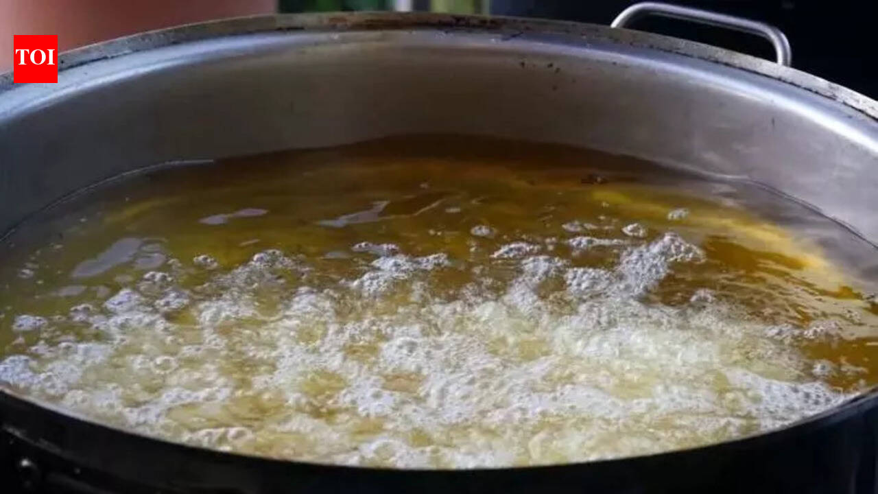 Woman accused of pouring hot oil on husband